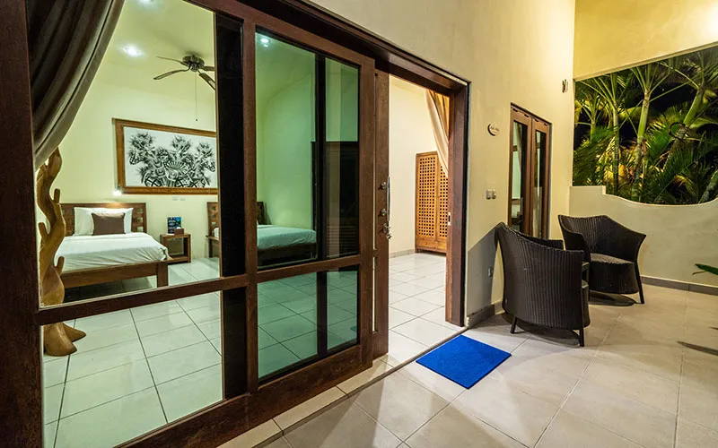 Terrace and sleeping area of a private bungalow at Ocean Sun Resort